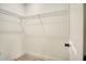 Walk-in closet with ample shelving and storage, maximizing space for organization at 701 Marion Oaks Trl, Ocala, FL 34473