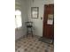 A corner of room featuring tiled floors, a stool, a window and an interior door at 710 W Swoope W Ave, Winter Park, FL 32789