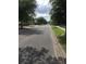 Residential street view showcasing a tree lined street with sidewalks and parked cars on the side at 710 W Swoope W Ave, Winter Park, FL 32789