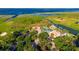 Overhead view highlighting the community's pool, clubhouse, lush green landscaping, and lake access at 711 Windlass Ct, Kissimmee, FL 34746