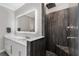 The bathroom provides an illuminated mirror over a vanity, and a walk-in shower with a built-in seat at 711 Windlass Ct, Kissimmee, FL 34746