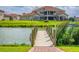 A private wooden dock with a brick path and lake views at 711 Windlass Ct, Kissimmee, FL 34746