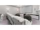 Spacious home theater featuring a large screen, projector, white leather reclining chairs, and speaker system at 711 Windlass Ct, Kissimmee, FL 34746