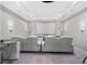 Home theater with a large screen, projector, white leather reclining chairs, and wall sconces at 711 Windlass Ct, Kissimmee, FL 34746