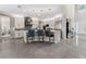 Bright, modern kitchen with stainless steel appliances, island with bar stools, and open layout at 711 Windlass Ct, Kissimmee, FL 34746