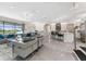 Bright, open-concept living room and kitchen with large windows overlooking the water at 711 Windlass Ct, Kissimmee, FL 34746