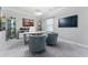 Well-lit office space featuring a white desk, comfortable seating, and attractive decor for an inspiring work environment at 711 Windlass Ct, Kissimmee, FL 34746