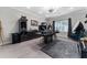 Modern office space with black furniture, unique decor, and lots of natural light at 711 Windlass Ct, Kissimmee, FL 34746