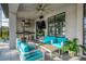 An expansive outdoor kitchen and bar area offers plenty of seating and a grill, perfect for backyard barbeques at 711 Windlass Ct, Kissimmee, FL 34746