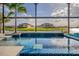 A luxurious pool boasts beautiful views of the water, creating a serene and inviting outdoor space at 711 Windlass Ct, Kissimmee, FL 34746