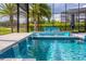 Enjoy the beautiful outdoor space with a waterfall feature into the pool and a comfortable seating area at 711 Windlass Ct, Kissimmee, FL 34746