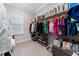 Spacious walk-in closet with ample shelving, hanging space, and a variety of storage options for clothes and accessories at 711 Windlass Ct, Kissimmee, FL 34746