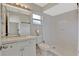 Bright bathroom featuring a white vanity, toilet, and tiled shower with modern fixtures and a mirrored medicine cabinet at 7709 Pine Hollow Ct, Orlando, FL 32822