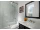Modern bathroom boasts a glass-enclosed shower, sleek vanity, and stylish mirror at 772 Pickfair Ter, Lake Mary, FL 32746