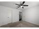 Bedroom with neutral carpet, ceiling fan, and doorway views of the hallway at 772 Pickfair Ter, Lake Mary, FL 32746