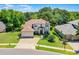 Beautiful two-story home with manicured landscaping and a brick driveway at 772 Pickfair Ter, Lake Mary, FL 32746
