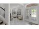 Bright foyer with marble floors, a glass door, and two chairs by a window at 772 Pickfair Ter, Lake Mary, FL 32746