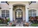 Close-up of the front door, featuring a brick walkway and manicured landscaping at 772 Pickfair Ter, Lake Mary, FL 32746