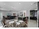 Open-concept living space featuring a modern kitchen, tile floors, and stylish furnishings at 772 Pickfair Ter, Lake Mary, FL 32746
