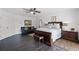 Spacious main bedroom with dark wood floors, ample closet space, and a comfortable seating area at 772 Pickfair Ter, Lake Mary, FL 32746