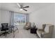 Bright home office with a ceiling fan, window view, and comfortable seating area at 772 Pickfair Ter, Lake Mary, FL 32746