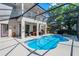 Backyard pool with hot tub and screened in porch with furniture at 772 Pickfair Ter, Lake Mary, FL 32746