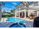 Inviting pool area with a screened enclosure, lounge furniture and outdoor seating at 772 Pickfair Ter, Lake Mary, FL 32746