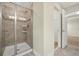 Bathroom featuring a tiled shower with glass door and a walk-in closet at 7809 Purple Finch St, Winter Garden, FL 34787