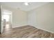 This bedroom is light and airy with wood-look floors and a double closet at 7809 Purple Finch St, Winter Garden, FL 34787