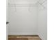 A walk-in closet featuring wire shelving and hardwood floors at 7809 Purple Finch St, Winter Garden, FL 34787