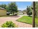 Paver driveway and green lawn with an inviting curb appeal at 7809 Purple Finch St, Winter Garden, FL 34787