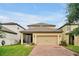 Charming single-Gathering home with a spacious garage, screened patio, and a brick paved driveway at 7809 Purple Finch St, Winter Garden, FL 34787
