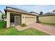Single-Gathering home featuring a spacious garage, screened-in patio, and well-maintained lawn at 7809 Purple Finch St, Winter Garden, FL 34787