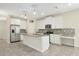 Bright kitchen featuring stainless steel appliances, granite countertops, an island, and mosaic backsplash at 7809 Purple Finch St, Winter Garden, FL 34787