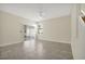 Bright living room with sliding glass doors, tile flooring, and a ceiling fan at 7809 Purple Finch St, Winter Garden, FL 34787