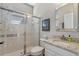 Bathroom with a glass-enclosed shower, granite vanity top, and neutral color palette for a serene experience at 8208 Westminster Abbey Blvd, Orlando, FL 32835