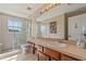 Bright bathroom featuring a glass-enclosed shower, a large mirror, and stylish fixtures at 8208 Westminster Abbey Blvd, Orlando, FL 32835