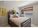 Charming bedroom with a cozy bed, playful decor, and a window with natural light, creating a cheerful space at 8208 Westminster Abbey Blvd, Orlando, FL 32835