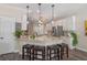 Spacious kitchen with granite countertops, stainless steel appliances, and a breakfast bar with seating at 8208 Westminster Abbey Blvd, Orlando, FL 32835