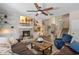 Cozy living room with a brick fireplace, built-in bookshelves, and comfortable seating at 8208 Westminster Abbey Blvd, Orlando, FL 32835