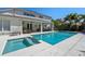 A stunning pool with a spa is located behind the house and is perfect for relaxation and entertainment at 8208 Westminster Abbey Blvd, Orlando, FL 32835
