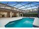 Sparkling pool with a jacuzzi and a spacious patio, all within a screened enclosure perfect for outdoor enjoyment at 8404 Secret Key Cv, Kissimmee, FL 34747