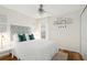 A simple and bright bedroom features stylish decor at 8404 Secret Key Cv, Kissimmee, FL 34747