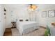 Comfortable bedroom with a king bed, leopard print pillows, and a vintage side table at 8404 Secret Key Cv, Kissimmee, FL 34747
