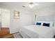 Airy bedroom with white canopy, blue accents, and a double closet at 8404 Secret Key Cv, Kissimmee, FL 34747