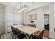 Bright dining room with natural light, neutral walls, modern light fixture and comfortable seating for gatherings at 8404 Secret Key Cv, Kissimmee, FL 34747
