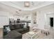 Comfortable living room with kitchen, stainless appliances, and an island with bar seating at 8404 Secret Key Cv, Kissimmee, FL 34747