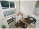 The living room and kitchen are viewed from above, showing an open concept and access to lanai at 8404 Secret Key Cv, Kissimmee, FL 34747