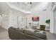 Bright living space with a high ceiling and a loft, complemented by neutral paint and a comfortable sofa at 8404 Secret Key Cv, Kissimmee, FL 34747
