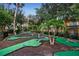 Community mini golf course with multiple green sections and landscaping at 8404 Secret Key Cv, Kissimmee, FL 34747
